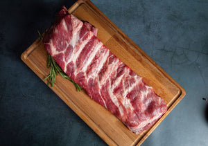 beef cut on a wooden cutting board