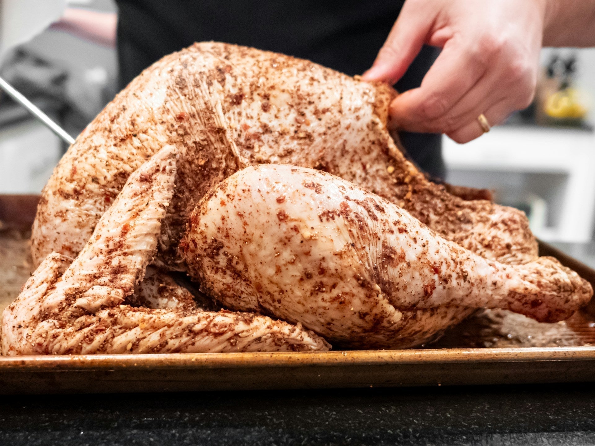 a turkey being brined on a tray