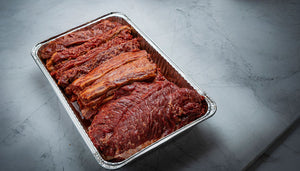 marinated Super Bowl meat in a tin