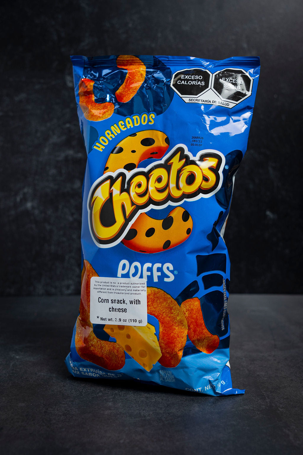 Bag of Cheetos Puffs on a dark background