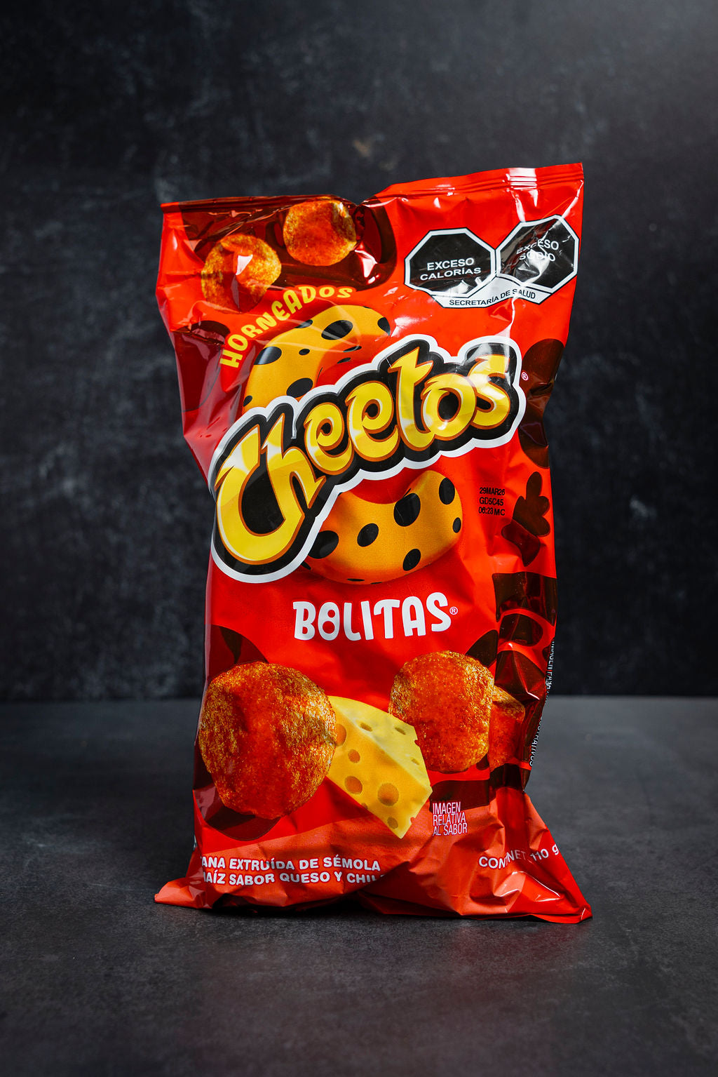 Cheetos Bolitas snack bag on a dark background