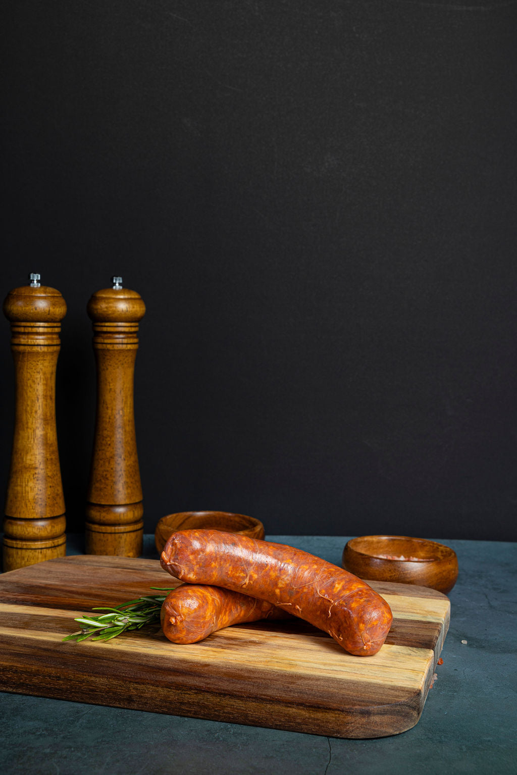 pork sausages on a wooden cutting board